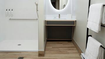 Shower, eco-friendly toiletries, hair dryer, towels