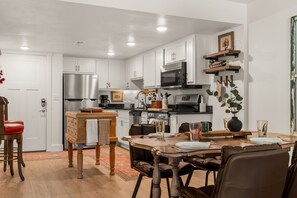 Fridge, microwave, oven, stovetop - Downtown Pet Friendly Creekside Condo • Walk to Branson Landing (Branson)
