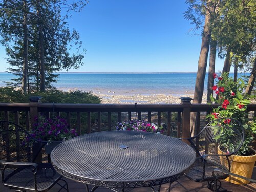 Home on Lake Huron with sandy beach and beautiful yards in Cheboygan, Michigan 