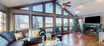 Riverfront retreat with seasonal heated pool, beach access, jetted tub & firepit