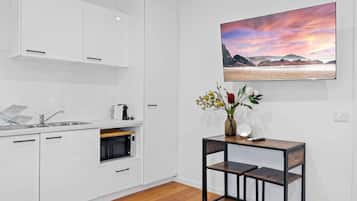 Fridge, microwave, stovetop, coffee/tea maker