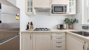 Fridge, microwave, stovetop, coffee/tea maker