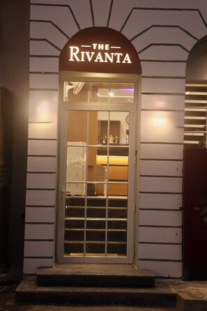 A hotel entrance with a sign reading "The Rivanta." - The Rivanta Hotel Near Airport Road Mohali Zirakpur Chandigarh (Zirakpur)