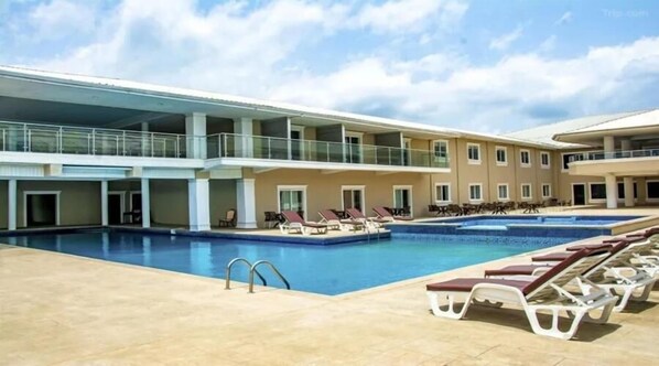 Outdoor pool, open 9:00 AM to 5:00 PM, pool umbrellas, pool loungers