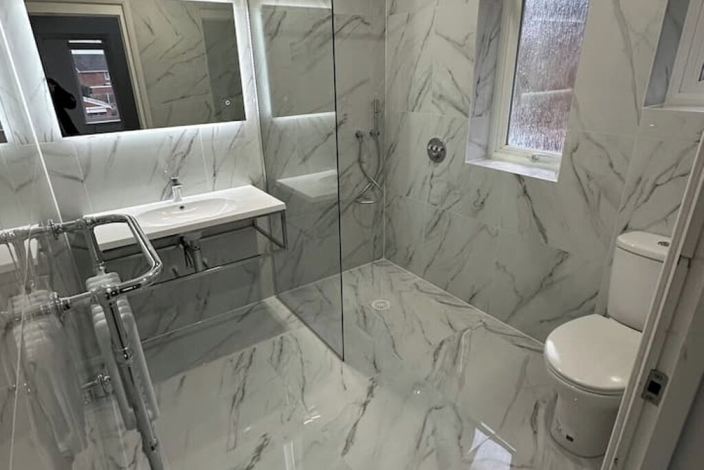 Shower, hair dryer, towels, toilet paper