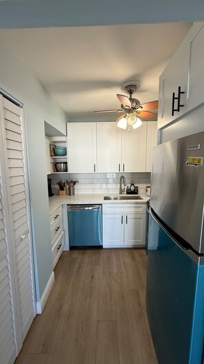 Fridge, microwave, oven, stovetop - Canal-front two-bedroom condo near Sunny Isles (North Miami Beach)