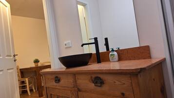 Basic Double Room, Courtyard View | Bathroom | Shower, hair dryer, towels, toilet paper