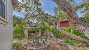A patio with a gazebo, chairs, and a small table. - 4028 Brambles - Just 5 Blocks from Downtown Carmel (Carmel)