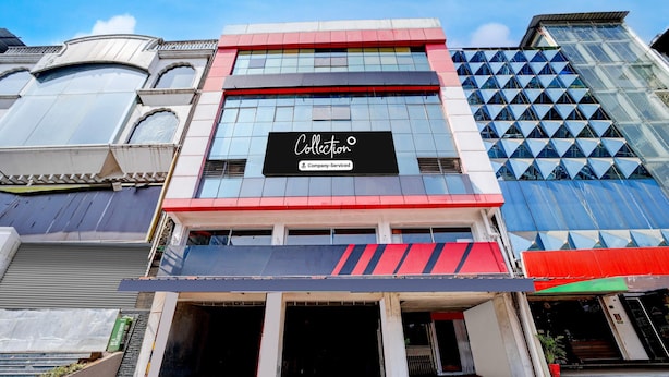 A building with a prominent 'Collection' sign, large windows, and a modern architectural design.