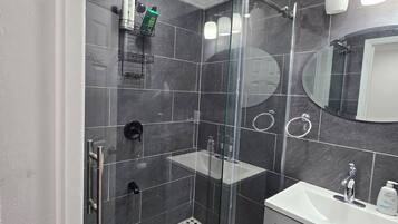 Shower, towels, soap, toilet paper