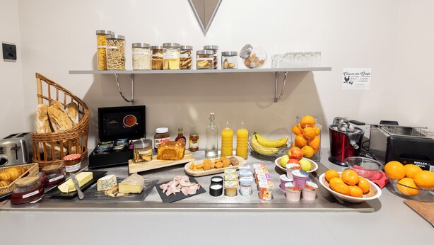 A breakfast buffet with various food items and condiments. - Hotel Restaurant de Paris (Jaligny-sur-Besbre)
