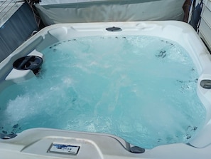 A hot tub with a control panel, surrounded by a metal frame. - Oceanview/Elevator/Pool/Hot tub/Steps to beach (Rodanthe)
