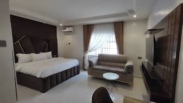 Family Room, Balcony, City View | Desk, laptop workspace, blackout drapes, soundproofing