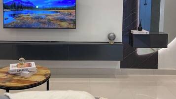 Family Apartment, Balcony, City View | In-room safe, desk, laptop workspace, blackout drapes