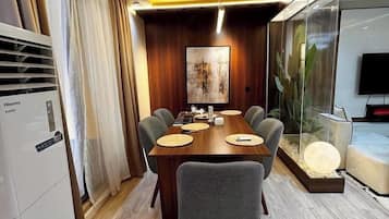 Family Apartment, Balcony, City View | Dining room