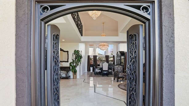 A spacious foyer with a polished marble floor, elegant furniture, and a large chandelier. - Luxury Mediterranean Villa w/ Pool - Sleeps 10 (Morgan Hill)