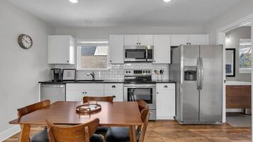 Hardwood table seats 4. Full fridge.