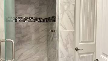Shower, towels, soap, toilet paper
