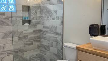Shower, hair dryer, towels, soap