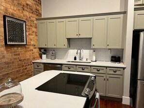 Fridge, microwave, oven, stovetop - Downtown GVL Loft-Style Condo in Historic Building (Greenville)