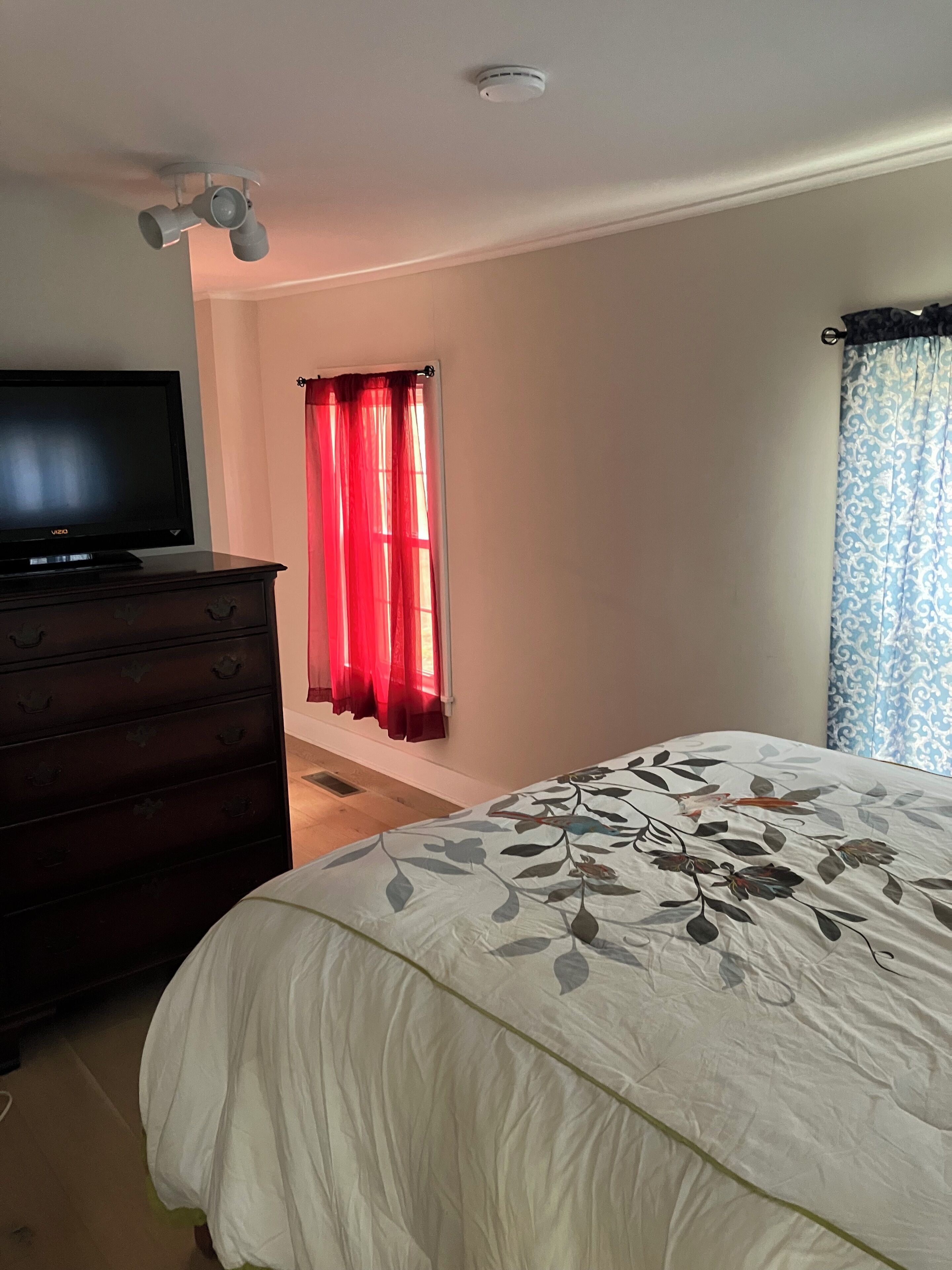 Downstairs bedroom with queen bed and full bath attached