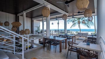 Breakfast, lunch, dinner served; beach views