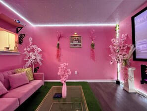 Living area - Pink Palace Cinema Oasis•Cozy Extravaganza•Beach (Gulfport)