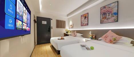 A hotel room with two beds, a flat-screen TV mounted on the wall, and a door leading to the hallway.