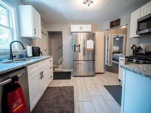 Fridge, microwave, stovetop, dishwasher - Walkable KC House: 3BR Near Shops & Dining (Kansas City)