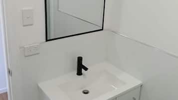 Shower, towels, soap, toilet paper