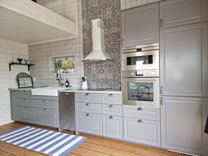 Fridge, microwave, oven, stovetop - Modern Cottage with Sea View in Svanesund | SE09151 (Svanesund)