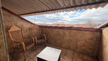 Suite, uitzicht op stad | Terras