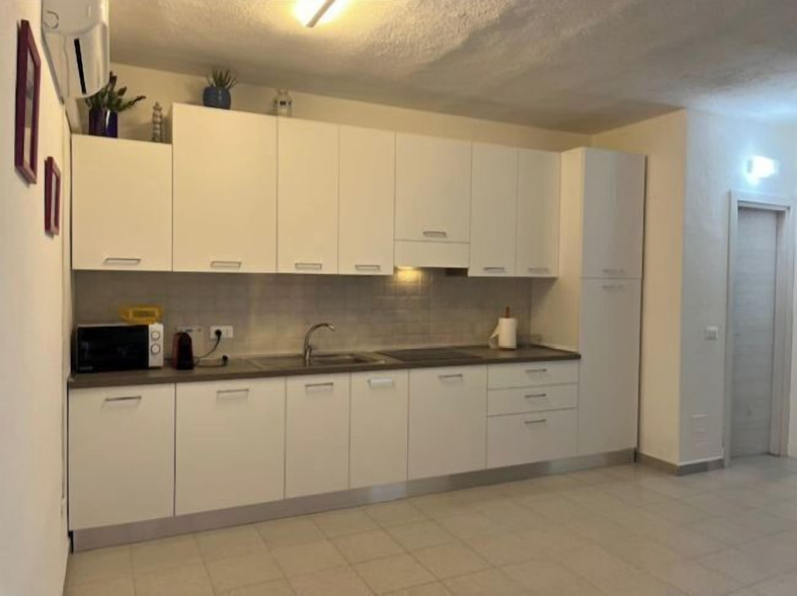 Condo | Private kitchenette | Full-size fridge, stovetop, cookware/dishes/utensils