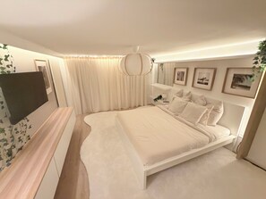 A bedroom with a bed, bedside table, lamp, and framed pictures on the wall. - 🌿PuraVida- Holiday home in the countryside near Freistadt |Large garden & dogs welcome (Sankt Peter)