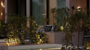 A modern hotel with a pool area, outdoor seating, and a balcony with a view. - Inanna Resort  (Batroun)