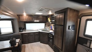 Private kitchen - Cozy RV at Rocky Creek Ranch Hot Tub Pet Private (Fredericksburg)