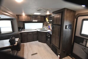 Private kitchen - Cozy RV at Rocky Creek Ranch Hot Tub Pet Private (Fredericksburg)