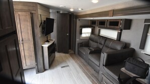 Living area - Cozy RV at Rocky Creek Ranch Hot Tub Pet Private (Fredericksburg)
