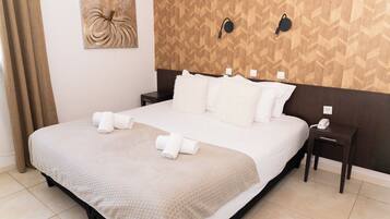 Comfort Room | Blackout drapes, iron/ironing board, free WiFi, bed sheets