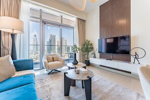 TV - High-Floor Balcony with Burj Khalifa View & Asst Room, Minutes from Burj Plaza (Dubai)