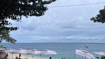 On the beach, sun loungers, beach towels