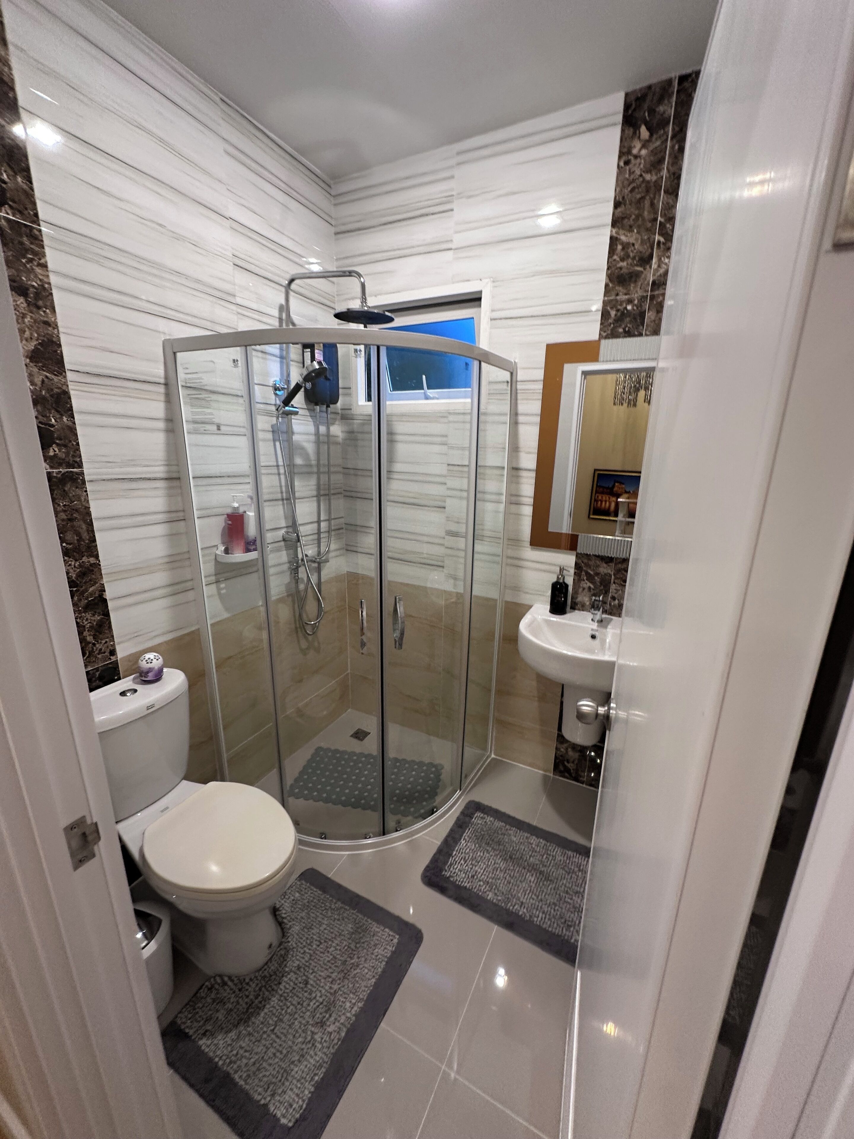 Shower, hair dryer, towels, soap