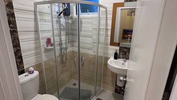 Shower, hair dryer, towels, soap