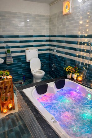 Shower, jetted tub, towels, soap