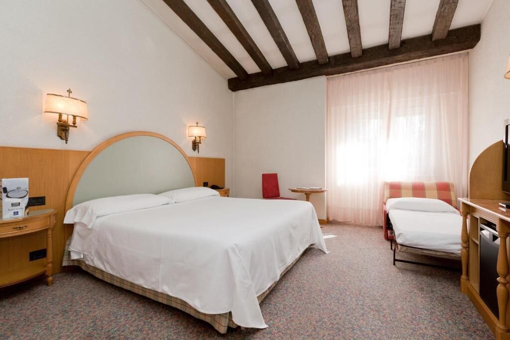 Triple Room, Garden View | In-room safe, soundproofing, iron/ironing board, free WiFi