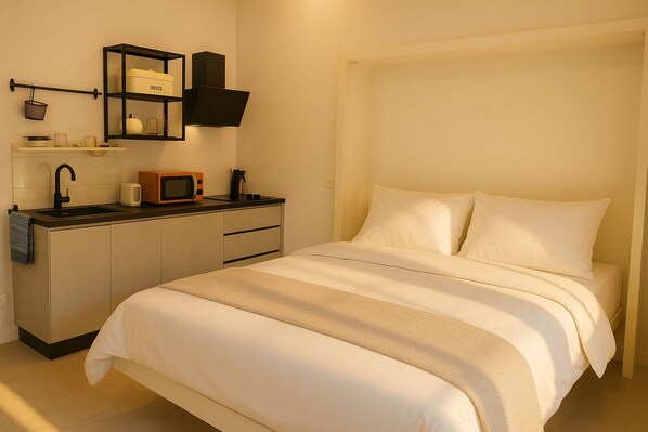 Deluxe Studio, Kitchenette | Individually decorated, individually furnished, iron/ironing board