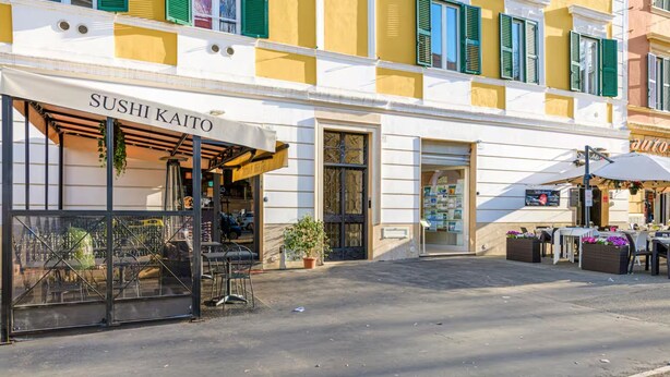 A sushi restaurant named SUSHI KAITO with outdoor seating and a storefront. - Vatican City Deluxe (Rome)