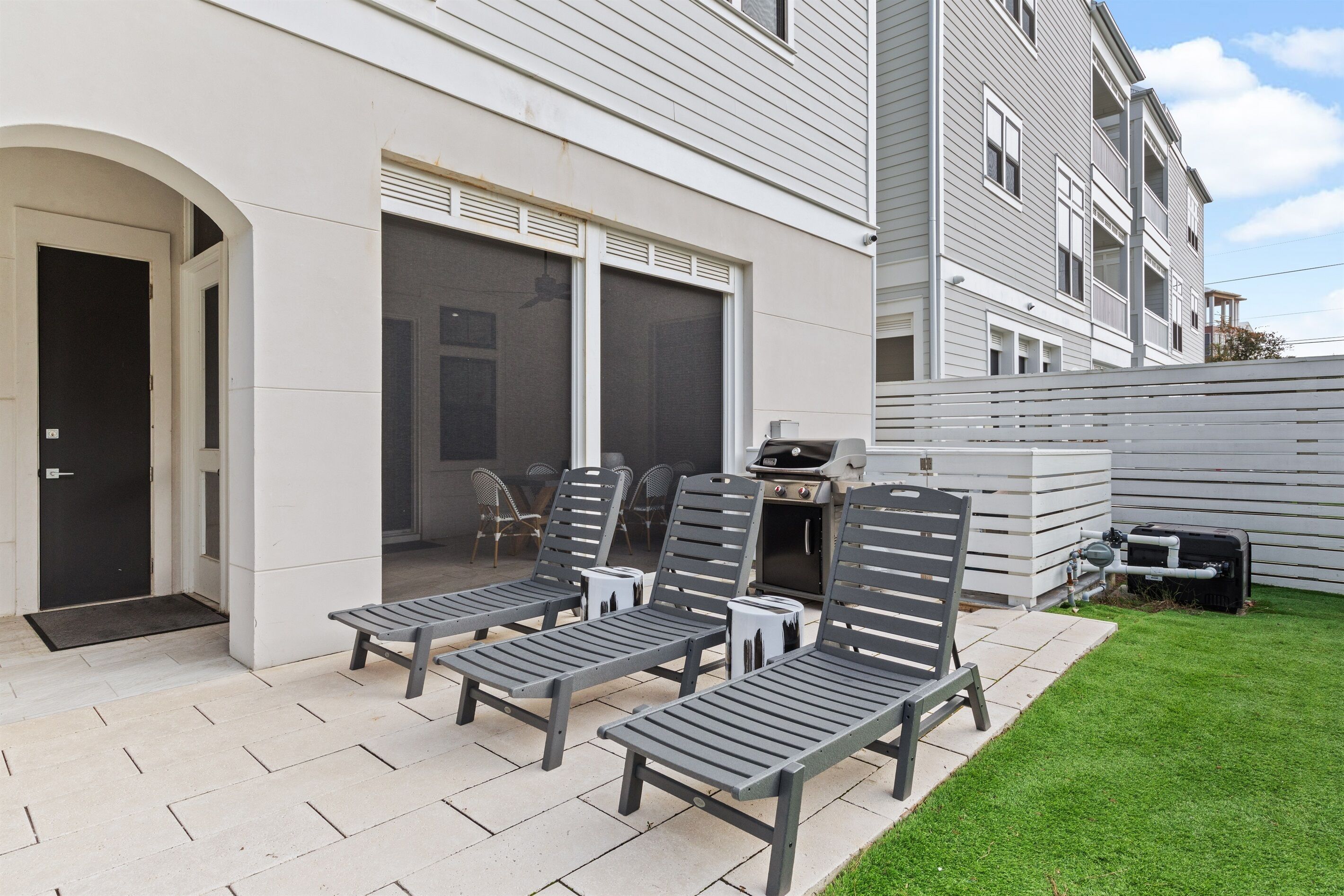 Step outside directly to the pool deck and outdoor dining area made for fun and connection. Enjoy the private saltwater plunge pool, propane grill, and space to lounge, dine, and relax—perfect for sunny afternoons and laid-back coastal evenings.