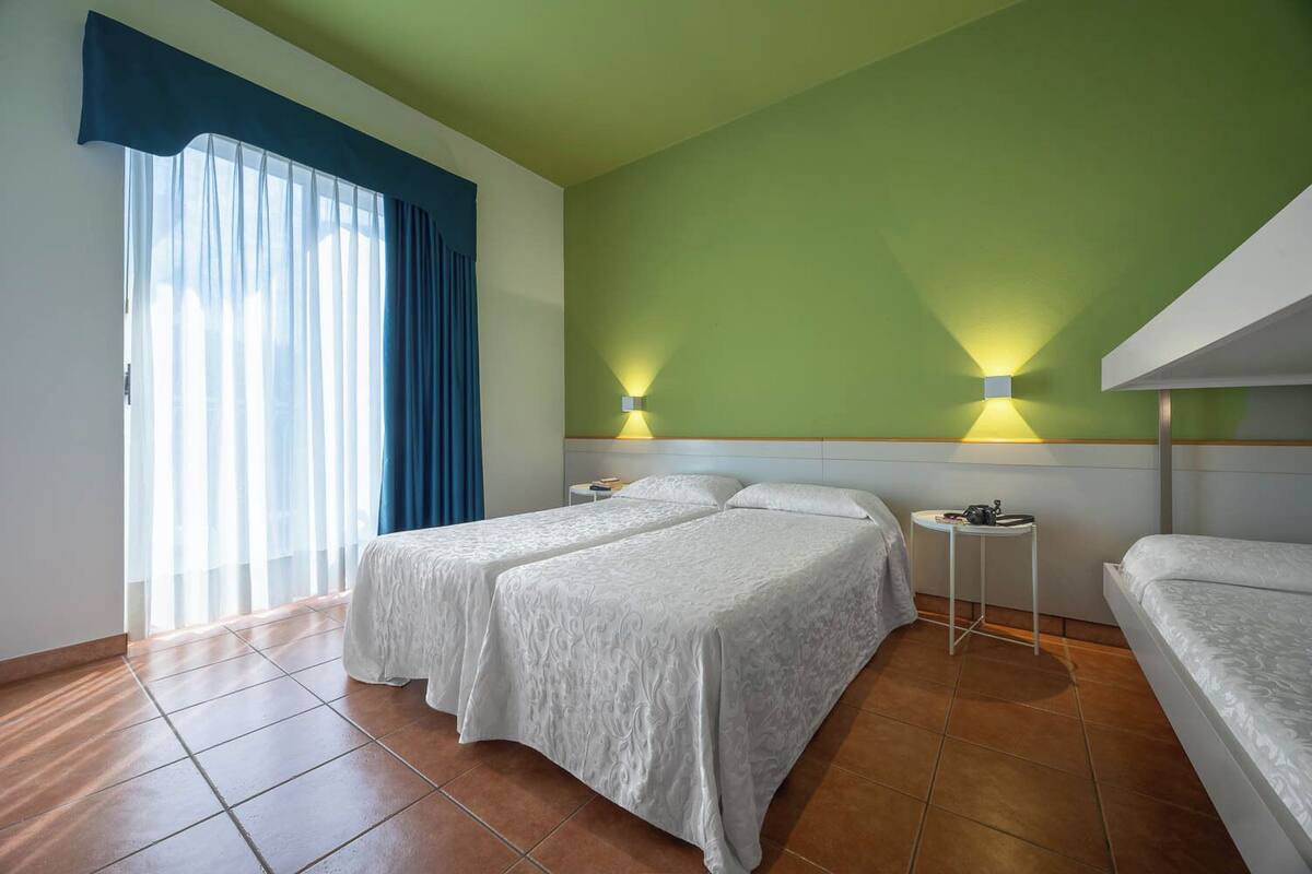 Comfort Quadruple Room, Balcony | In-room safe, iron/ironing board (on request), WiFi (free), bed sheets
