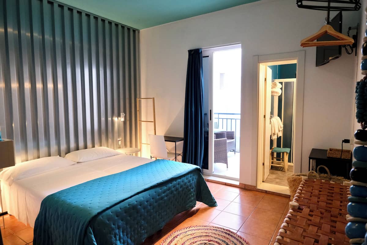 Economy Quadruple Room, Balcony | In-room safe, iron/ironing board (on request), WiFi (free), bed sheets